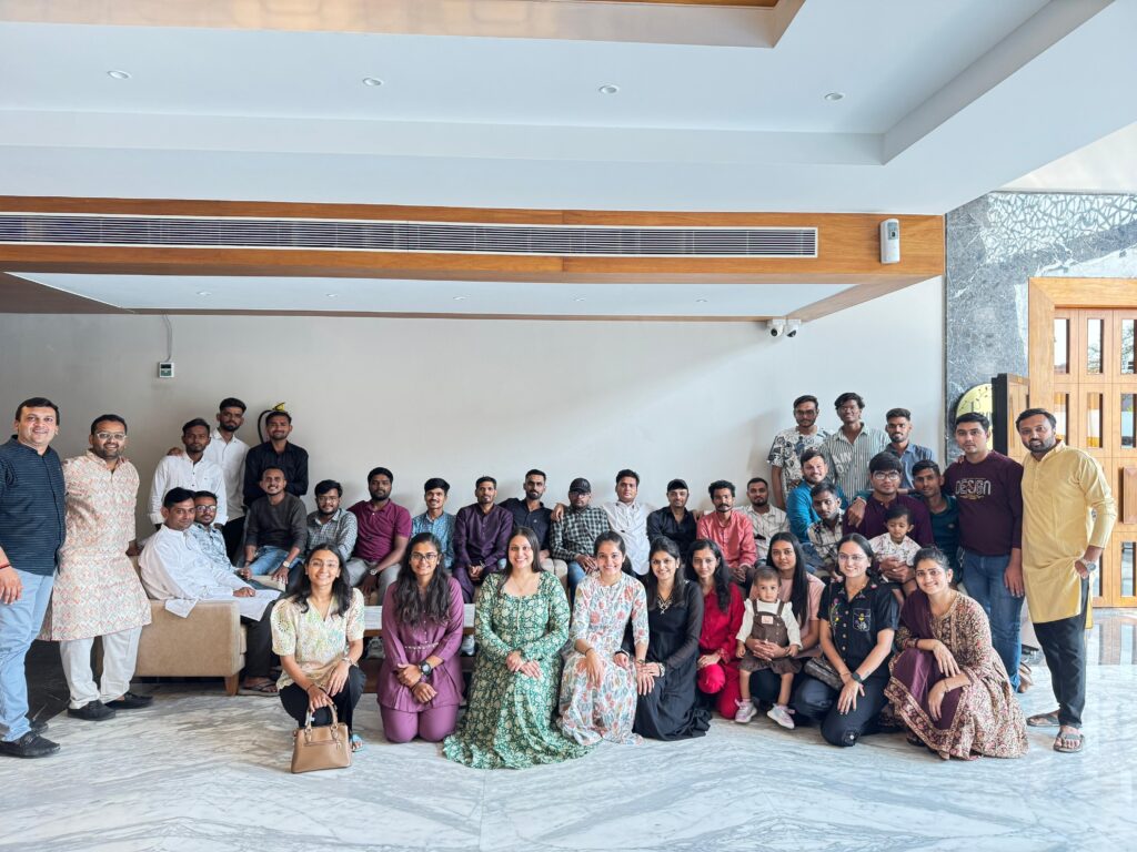 The Flame Solren team gathered for a group photo in a large hall